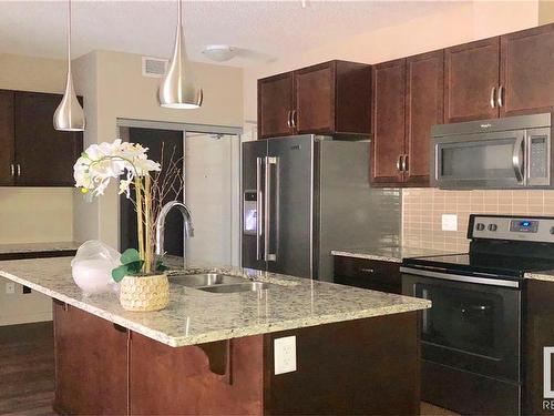 108 504 Griesbach Parade, Edmonton, AB - Indoor Photo Showing Kitchen With Double Sink With Upgraded Kitchen