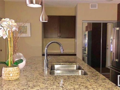 108 504 Griesbach Parade, Edmonton, AB - Indoor Photo Showing Kitchen With Double Sink