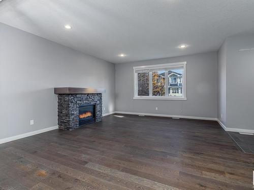 5108 Corvette Street, Edmonton, AB - Indoor Photo Showing Living Room With Fireplace