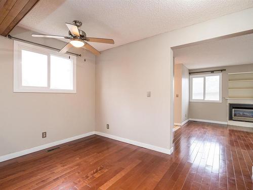 10522 21 Avenue, Edmonton, AB - Indoor Photo Showing Other Room With Fireplace