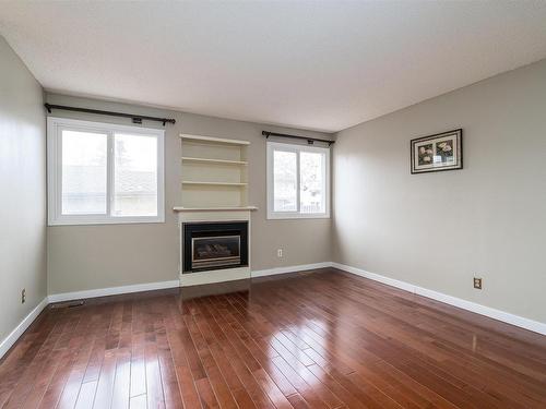 10522 21 Avenue, Edmonton, AB - Indoor Photo Showing Living Room With Fireplace