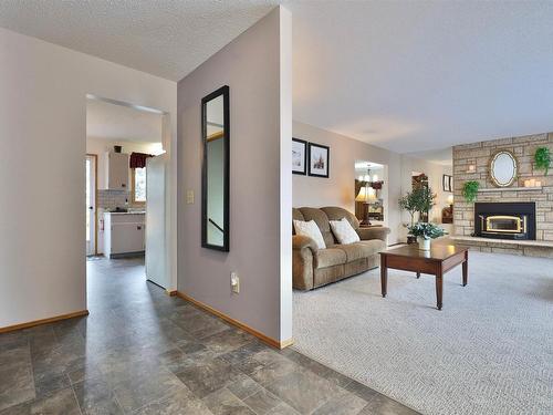 5152 32 Street, Rural Wetaskiwin County, AB - Indoor Photo Showing Living Room With Fireplace