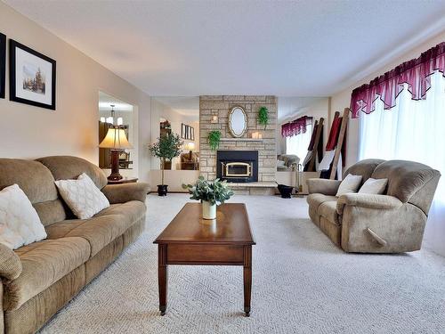 5152 32 Street, Rural Wetaskiwin County, AB - Indoor Photo Showing Living Room With Fireplace