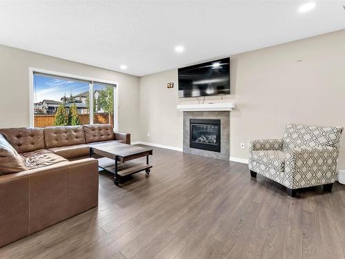 720 40 Avenue, Edmonton, AB - Indoor Photo Showing Living Room With Fireplace