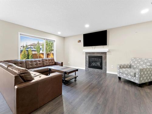 720 40 Avenue, Edmonton, AB - Indoor Photo Showing Living Room With Fireplace