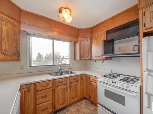 5105 57 Avenue, Leduc, AB - Indoor Photo Showing Kitchen With Double Sink