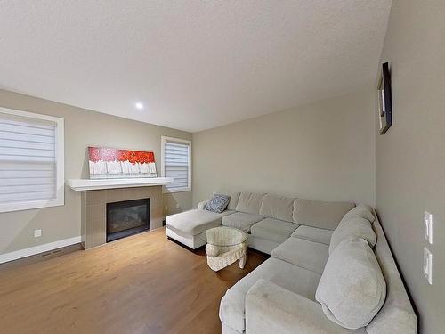 3938 Cherry Cove Sw, Edmonton, AB - Indoor Photo Showing Living Room With Fireplace