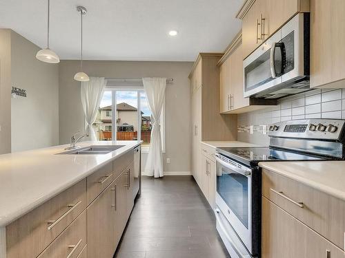 880 Cy Becker Drive, Edmonton, AB - Indoor Photo Showing Kitchen With Double Sink With Upgraded Kitchen