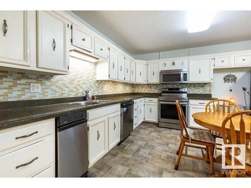 411 14810 51 Avenue, Edmonton, AB - Indoor Photo Showing Kitchen With Double Sink