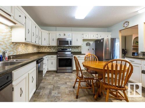 411 14810 51 Avenue, Edmonton, AB - Indoor Photo Showing Kitchen With Double Sink