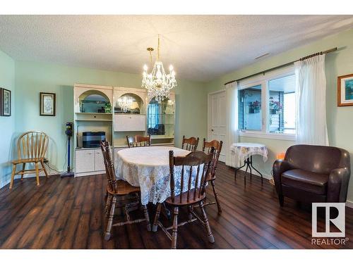 411 14810 51 Avenue, Edmonton, AB - Indoor Photo Showing Dining Room With Fireplace