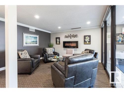 411 14810 51 Avenue, Edmonton, AB - Indoor With Fireplace