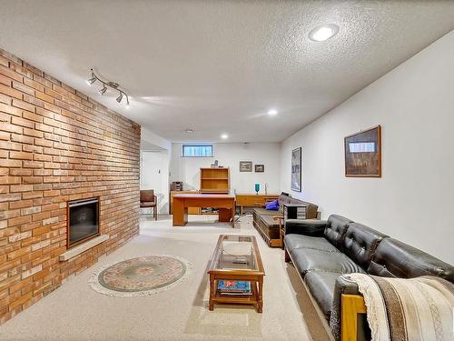 2A Westbrook Drive, Edmonton, AB - Indoor Photo Showing Living Room With Fireplace