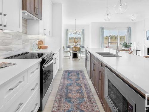 306 Juniper Cove, Leduc, AB - Indoor Photo Showing Kitchen With Double Sink With Upgraded Kitchen