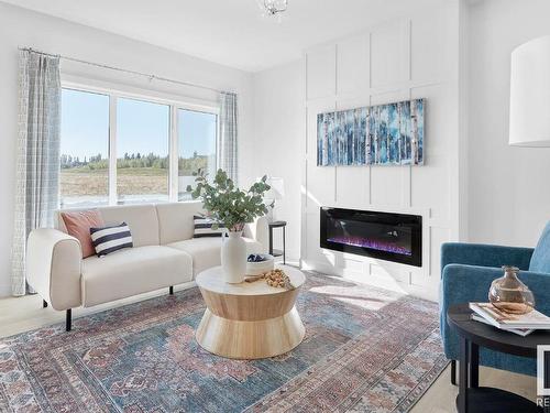 306 Juniper Cove, Leduc, AB - Indoor Photo Showing Living Room With Fireplace