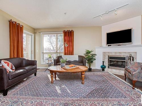 301 10528 77 Avenue, Edmonton, AB - Indoor Photo Showing Living Room With Fireplace