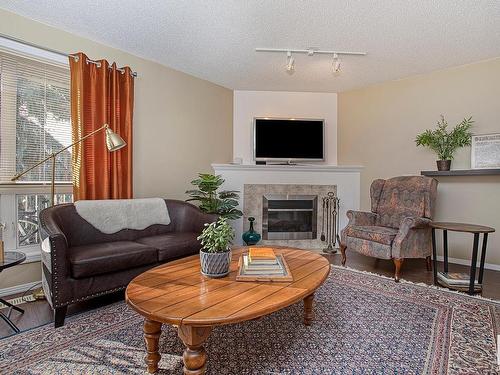 301 10528 77 Avenue, Edmonton, AB - Indoor Photo Showing Living Room With Fireplace