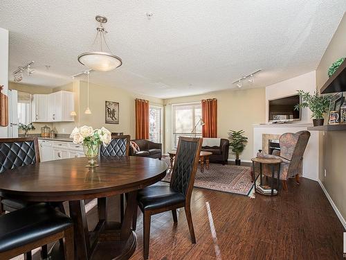 301 10528 77 Avenue, Edmonton, AB - Indoor Photo Showing Dining Room With Fireplace