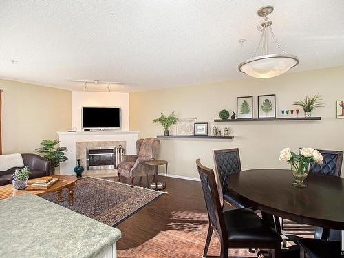 301 10528 77 Avenue, Edmonton, AB - Indoor Photo Showing Dining Room With Fireplace