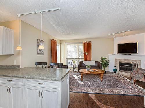 301 10528 77 Avenue, Edmonton, AB - Indoor Photo Showing Living Room With Fireplace