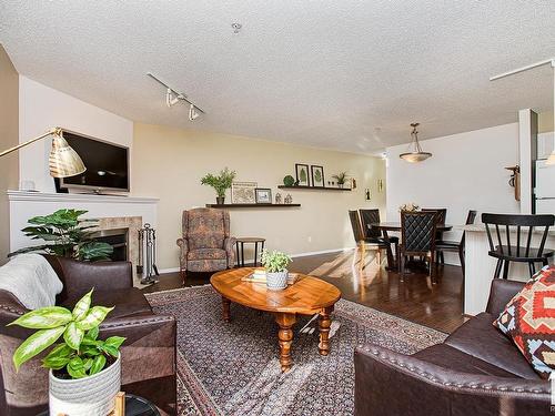 301 10528 77 Avenue, Edmonton, AB - Indoor Photo Showing Living Room With Fireplace