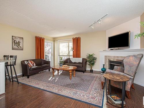 301 10528 77 Avenue, Edmonton, AB - Indoor Photo Showing Living Room With Fireplace