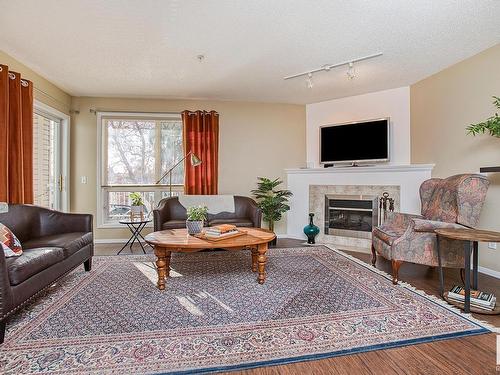 301 10528 77 Avenue, Edmonton, AB - Indoor Photo Showing Living Room With Fireplace