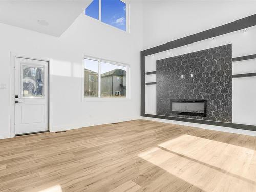 Stony Plain, AB - Indoor Photo Showing Living Room With Fireplace