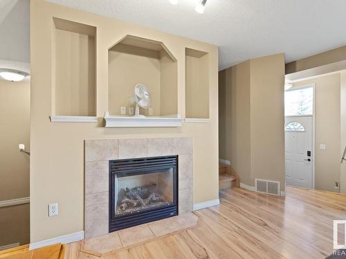 114 178 Bridgeport Boulevard, Leduc, AB - Indoor Photo Showing Living Room With Fireplace