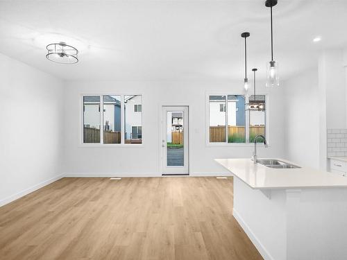 57 Elliott Wynd, Fort Saskatchewan, AB - Indoor Photo Showing Kitchen With Double Sink