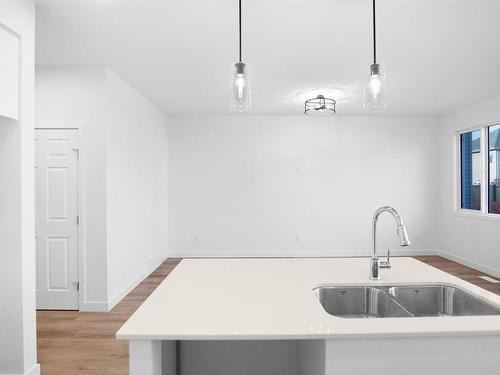 57 Elliott Wynd, Fort Saskatchewan, AB - Indoor Photo Showing Kitchen With Double Sink