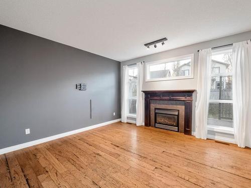 124 Keyport Circle, Leduc, AB - Indoor Photo Showing Living Room With Fireplace