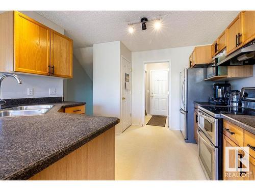 9806 179 Avenue, Edmonton, AB - Indoor Photo Showing Kitchen With Double Sink