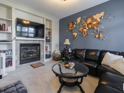 5052 Mcluhan Road, Edmonton, AB - Indoor Photo Showing Living Room With Fireplace