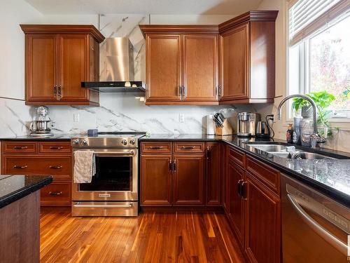 5052 Mcluhan Road, Edmonton, AB - Indoor Photo Showing Kitchen With Double Sink