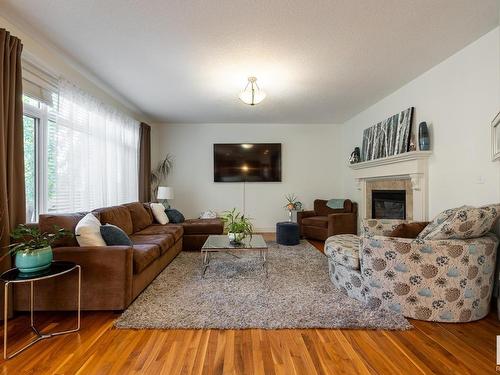 5052 Mcluhan Road, Edmonton, AB - Indoor Photo Showing Living Room With Fireplace