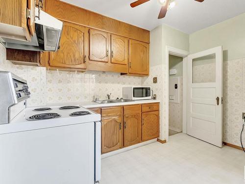 11329 94 Street, Edmonton, AB - Indoor Photo Showing Kitchen With Double Sink