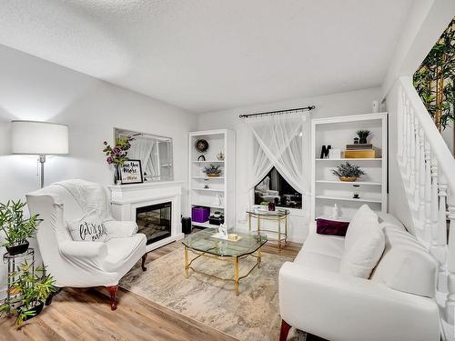 7 Greenfield Estates, St. Albert, AB - Indoor Photo Showing Living Room With Fireplace