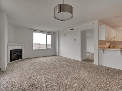 505 10649 Saskatchewan Drive, Edmonton, AB - Indoor Photo Showing Other Room With Fireplace