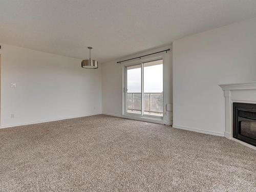 505 10649 Saskatchewan Drive, Edmonton, AB - Indoor Photo Showing Other Room With Fireplace