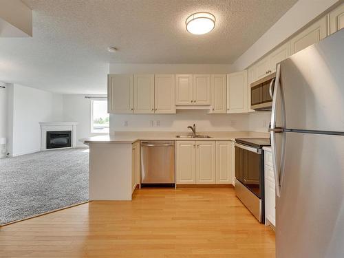 505 10649 Saskatchewan Drive, Edmonton, AB - Indoor Photo Showing Kitchen With Double Sink