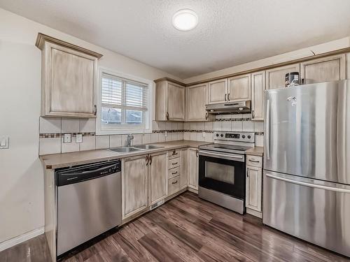 56 Martin Crossing Crescent Ne, Calgary, AB - Indoor Photo Showing Kitchen With Double Sink