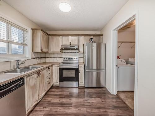 56 Martin Crossing Crescent Ne, Calgary, AB - Indoor Photo Showing Kitchen With Double Sink