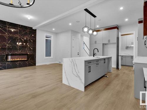 6722 Crawford Way, Edmonton, AB - Indoor Photo Showing Kitchen With Fireplace