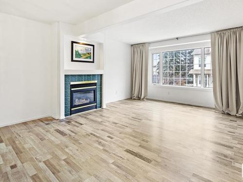 23 9630 176 Street, Edmonton, AB - Indoor Photo Showing Living Room With Fireplace