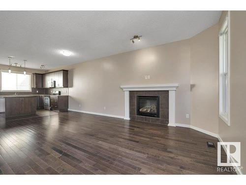 5921 168A Avenue, Edmonton, AB - Indoor Photo Showing Living Room With Fireplace