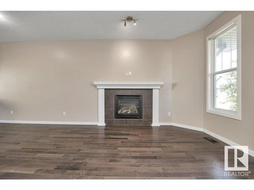 5921 168A Avenue, Edmonton, AB - Indoor Photo Showing Living Room With Fireplace