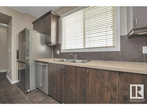 5921 168A Avenue, Edmonton, AB - Indoor Photo Showing Kitchen With Double Sink