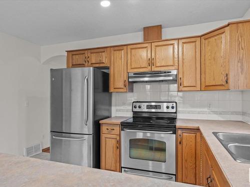 16 Heritage Crescent, Stony Plain, AB - Indoor Photo Showing Kitchen With Double Sink