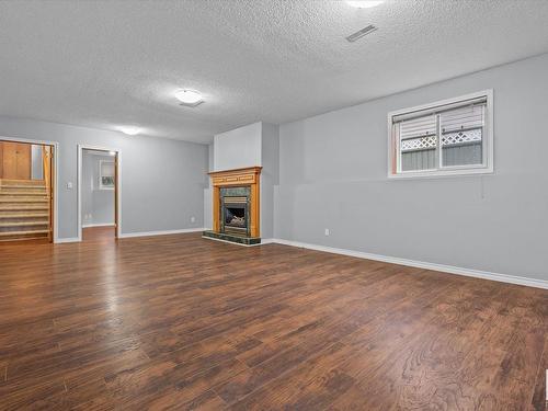 16 Heritage Crescent, Stony Plain, AB - Indoor Photo Showing Living Room With Fireplace